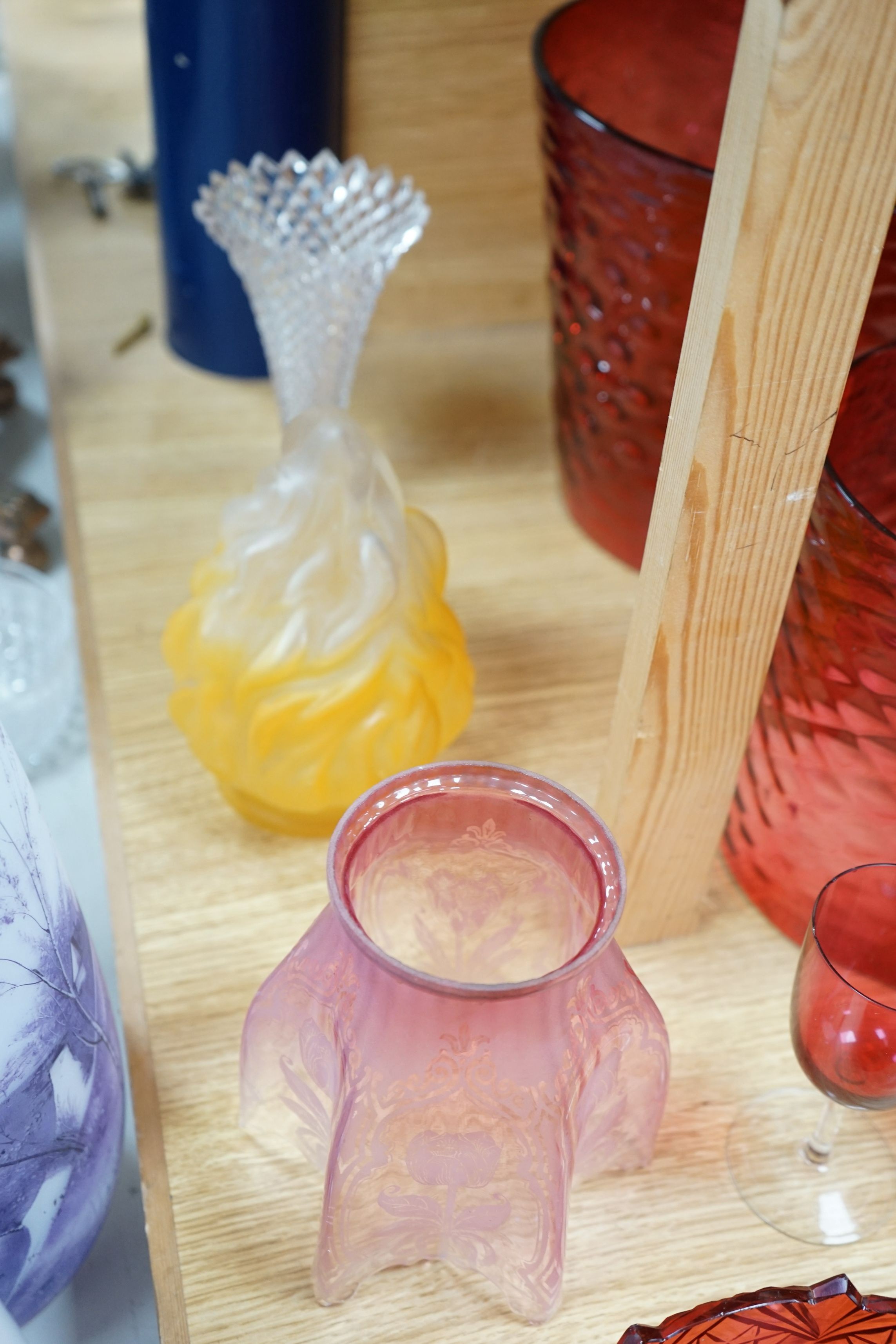 Three cranberry glass shades together with mixed cranberry and other glass, tallest shade 23cms high